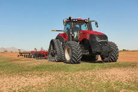 Case IH Magnum 340 working in field with attachment