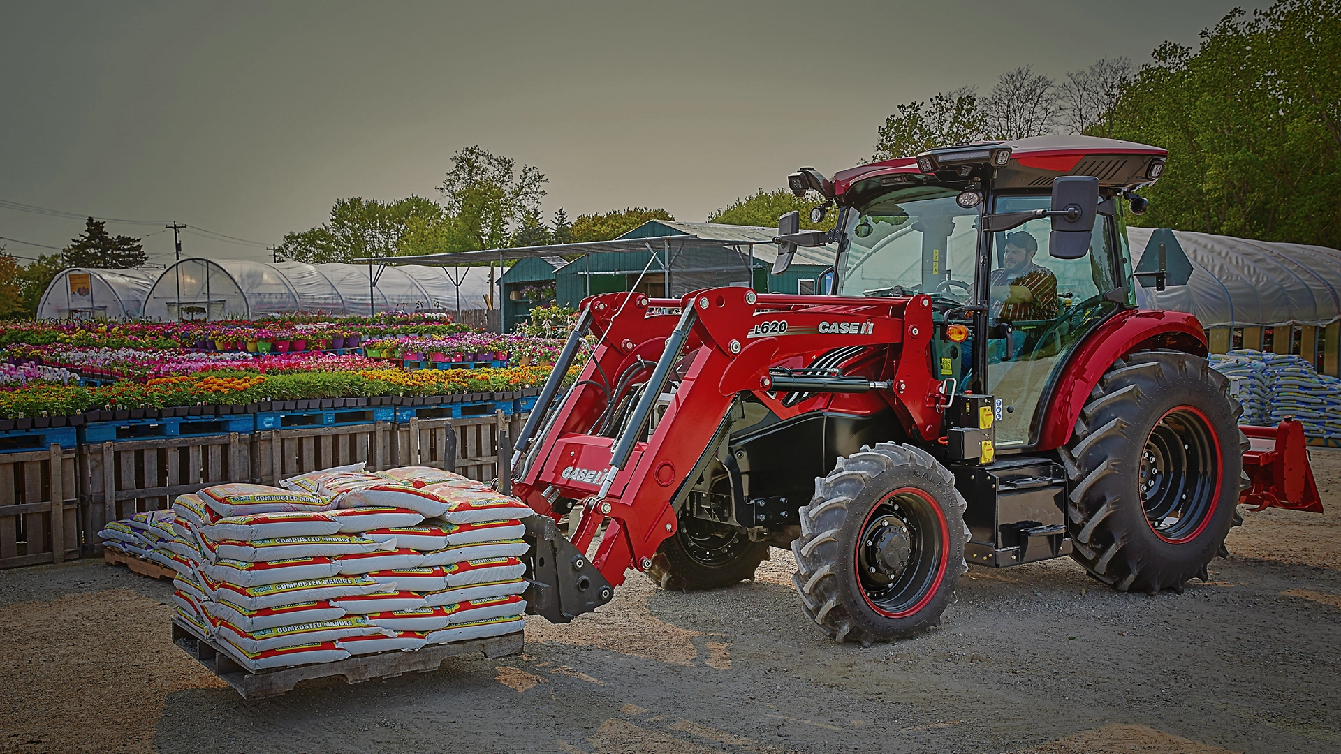 Farmall Electric tractor with pallet at garden center