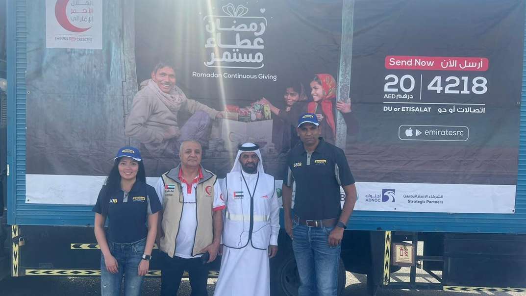 New Holland Middle East and Africa team distributes 500 meal packs to people in labor camps