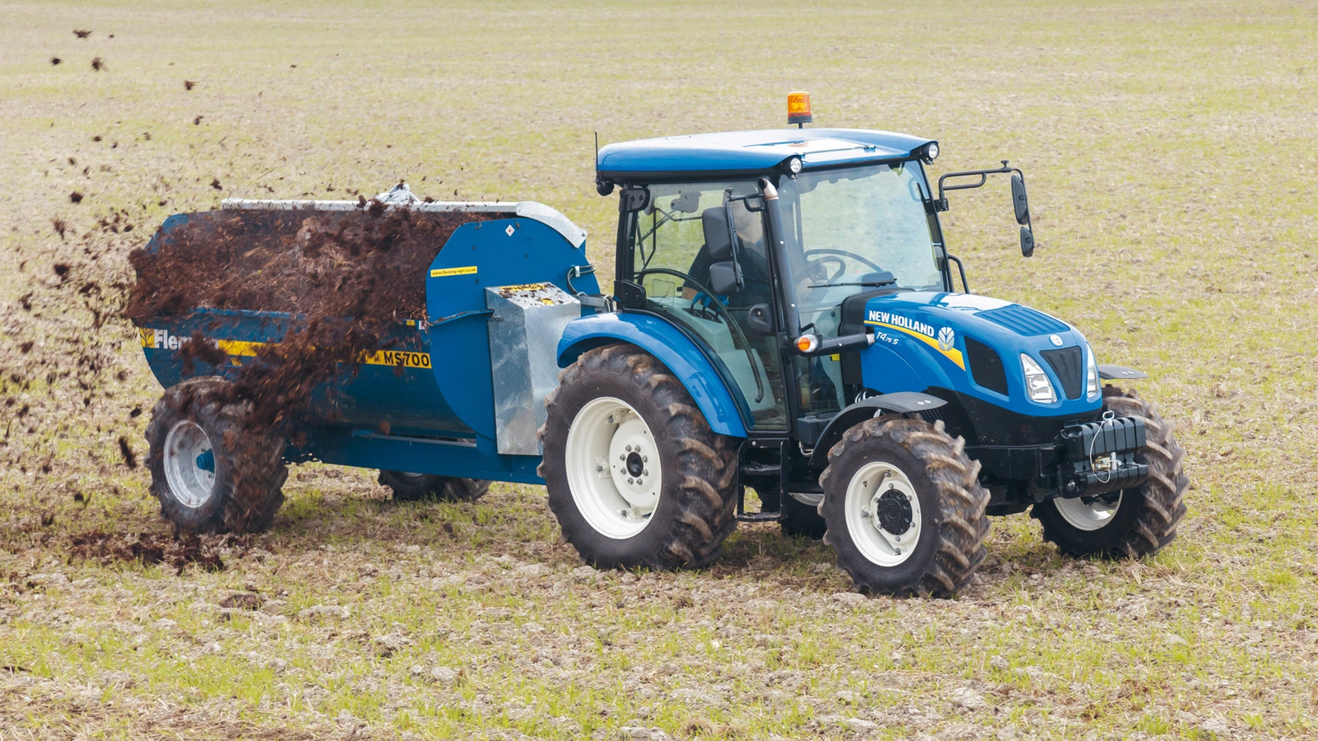 Agricultural duties being performed by New Holland T4S farming tractor