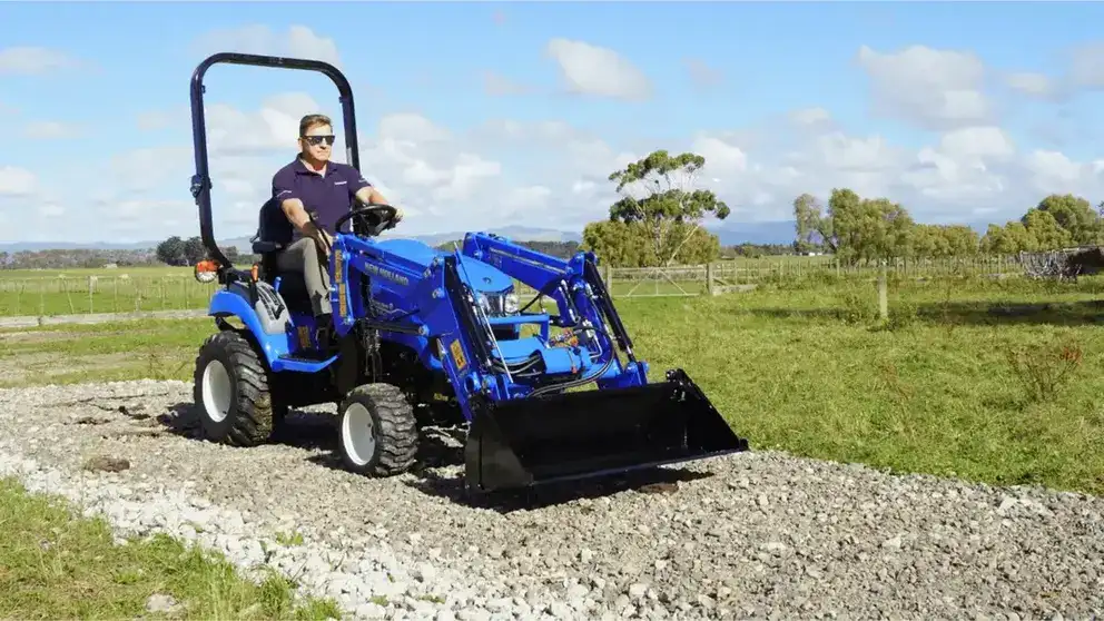 New Holland Boomer tractor sitting in field