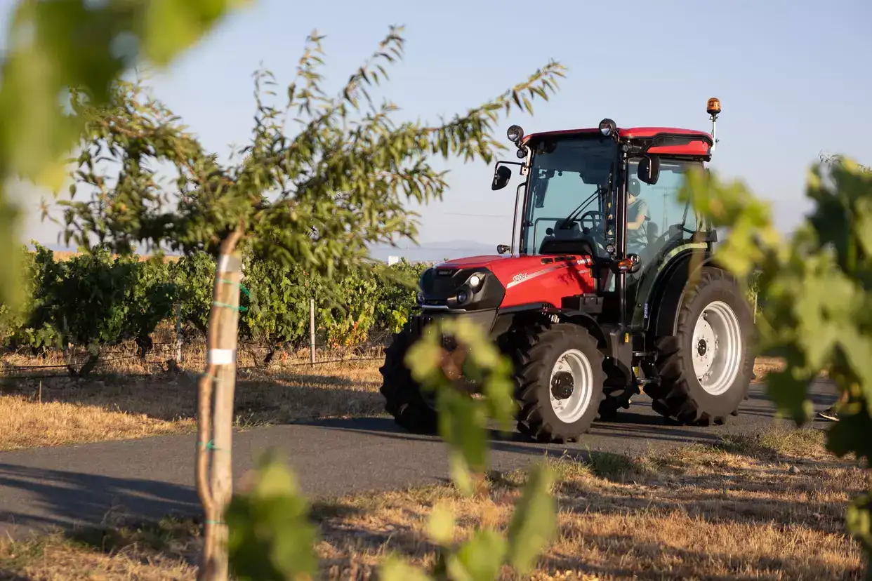 Farmall 120CL on path with tree in foreground
