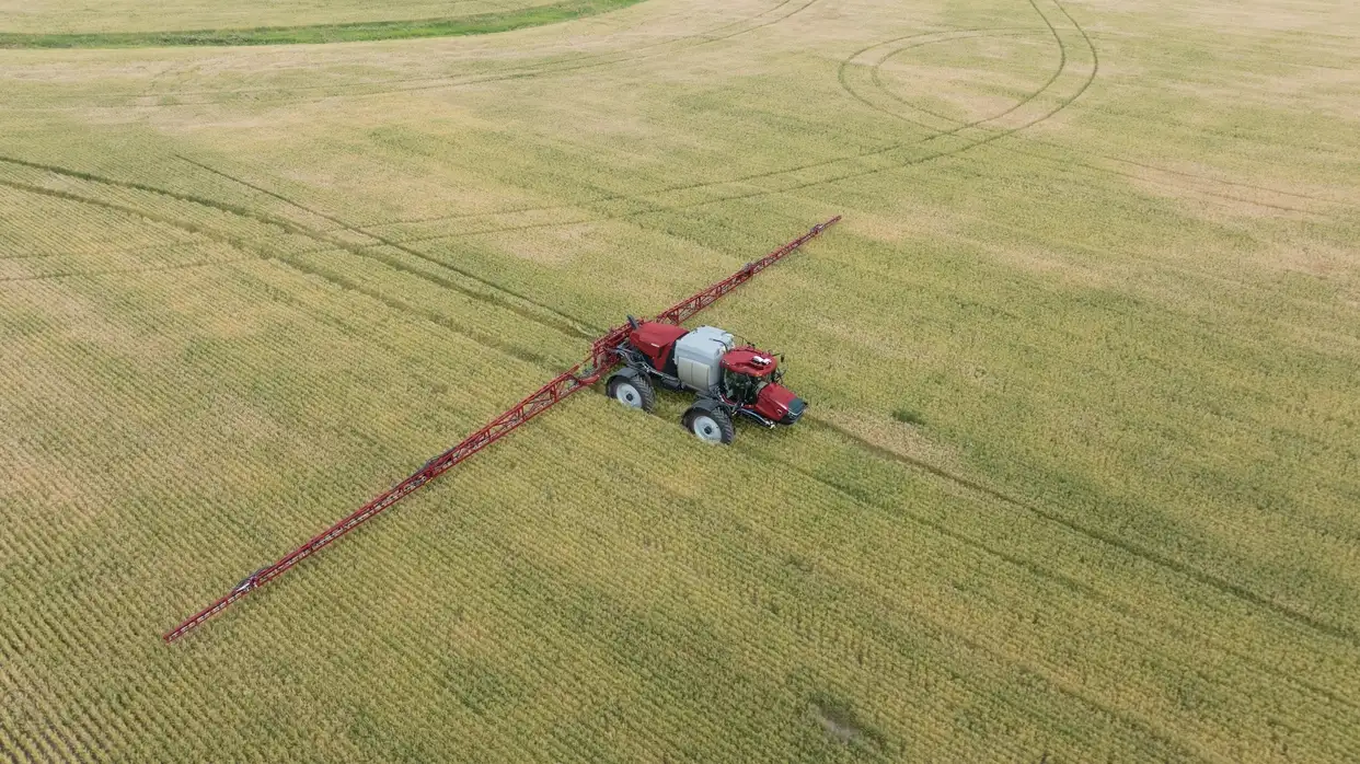 Aerial view of a Case IH Patriot 4450 sprayer working in a field. 