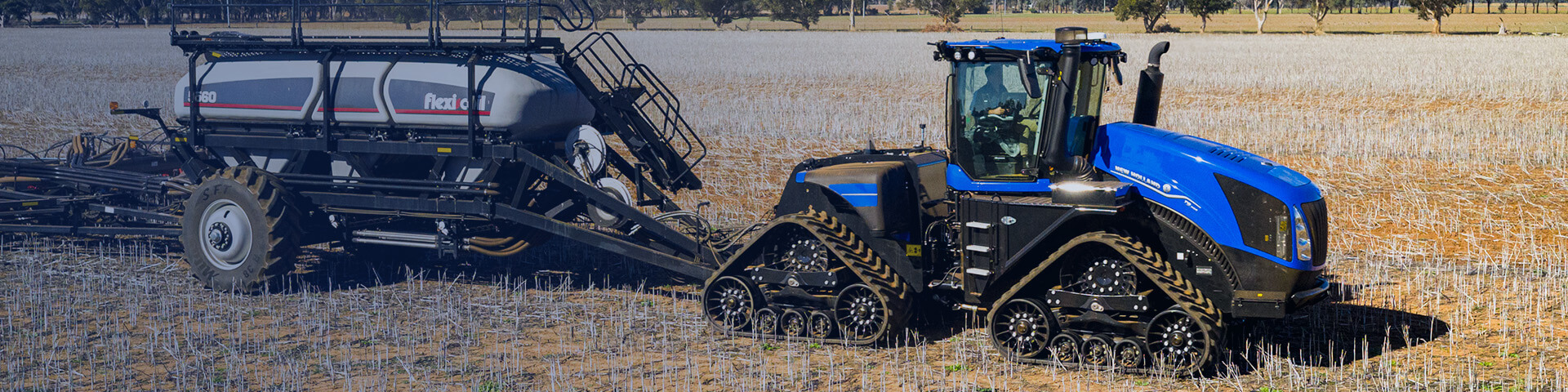 New Holland T9 SmartTrax configuration working in field with Flexi-Coil air cart attached to it