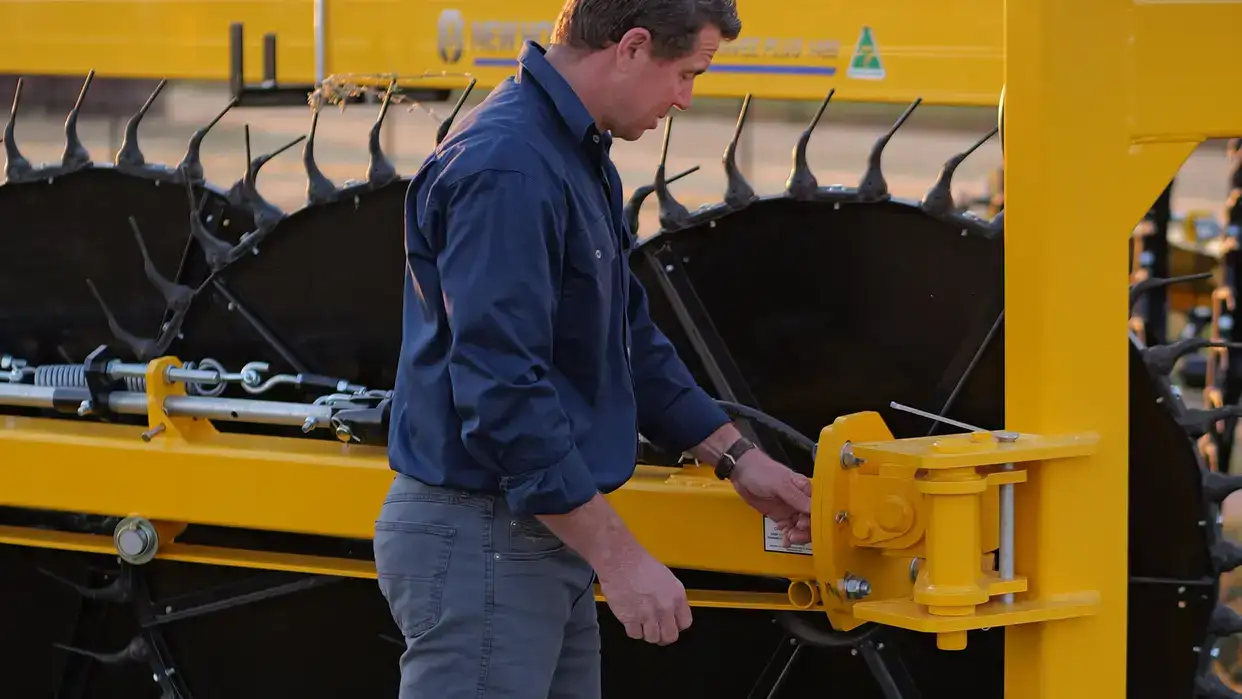 New Holland DuraVee trailing rakes working in field
