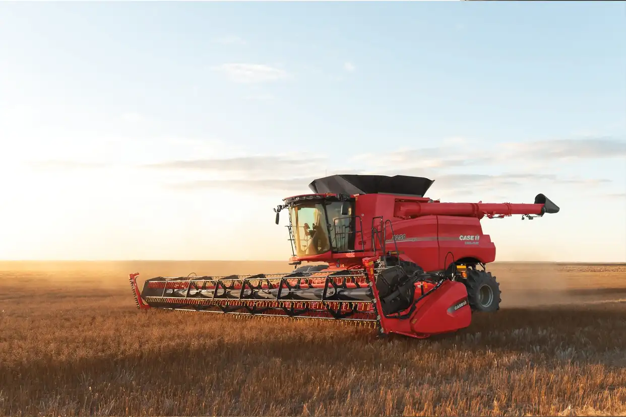 Red Case IH Axial-Flow 250 Series with VariCut 3050 header working in field