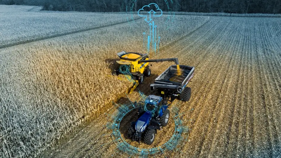 New Holland tractor and combine utilize cart automation in the field for harvesting