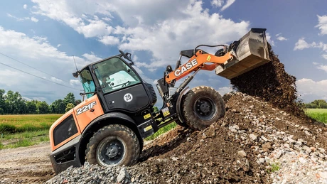 CASE F Series Compact Wheel Loader on hill dumping dirt