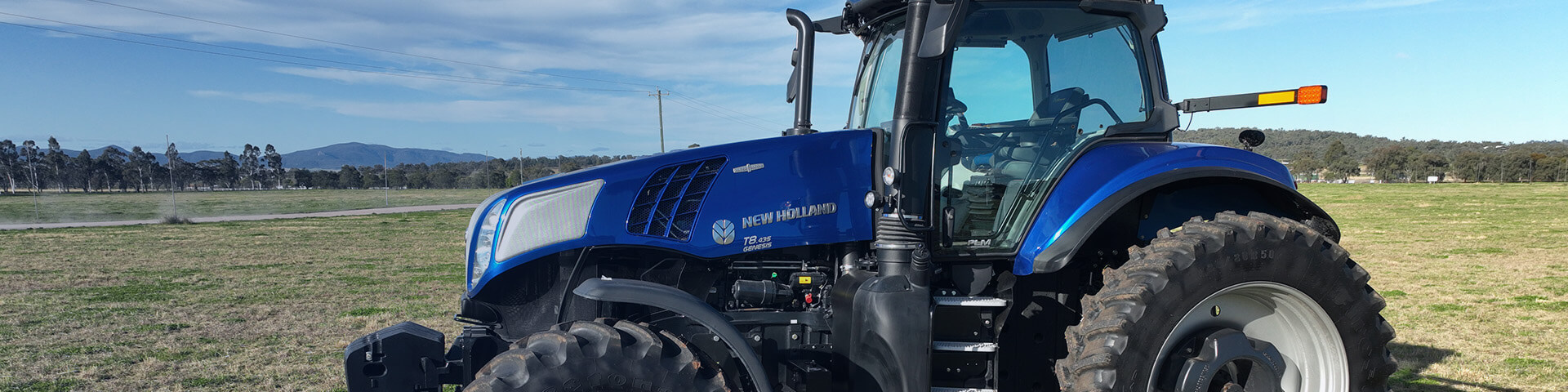 New Holland T8 tractor sitting in field in Gunnedah, New South Wales, Australia