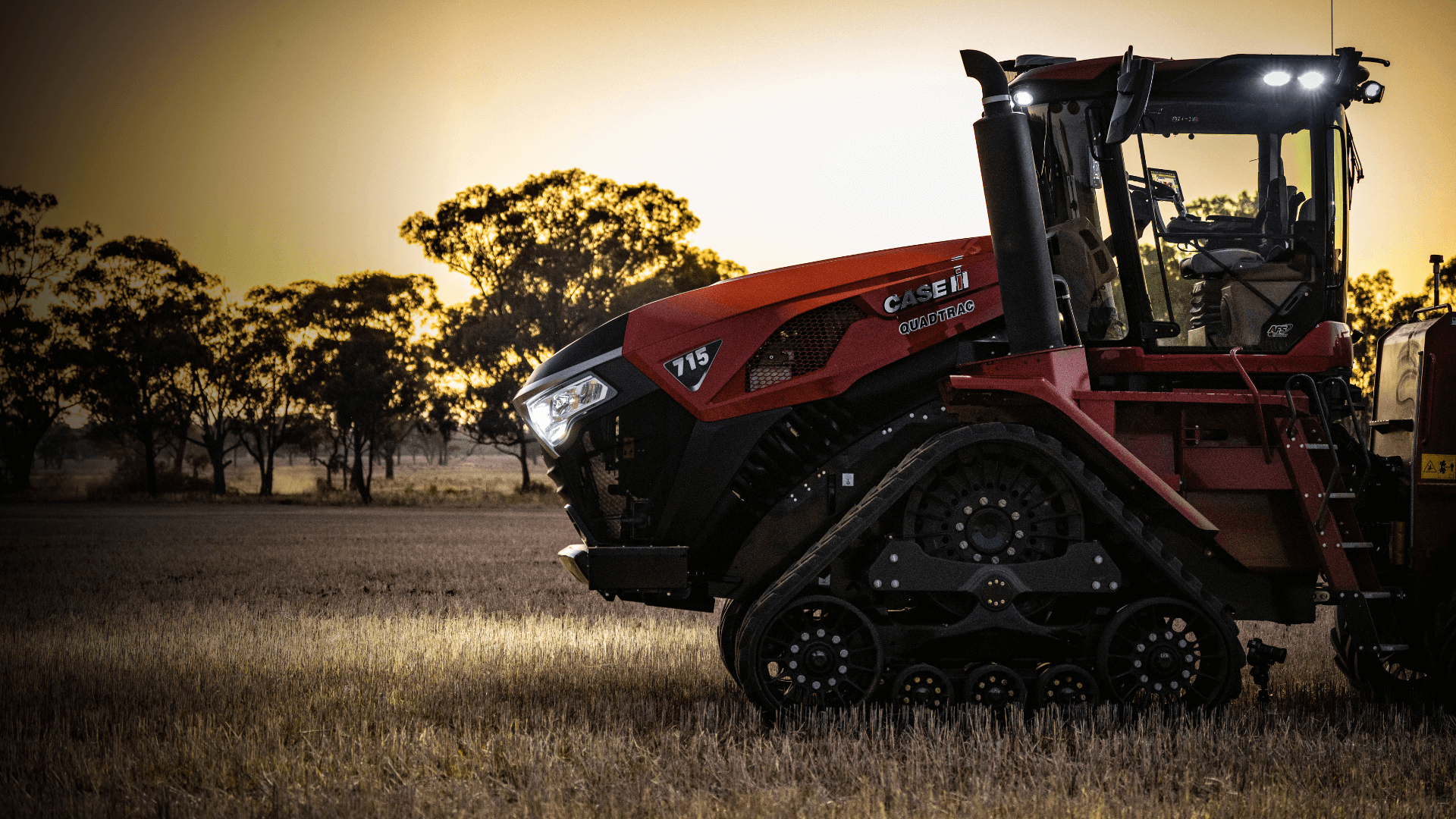Steiger Series 715 tractor in field with sunset backdrop