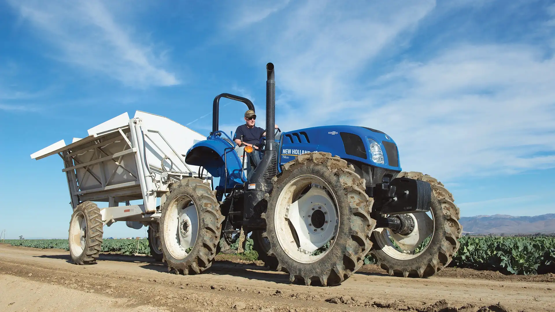 TS6 Series II tractor pulls a trailer