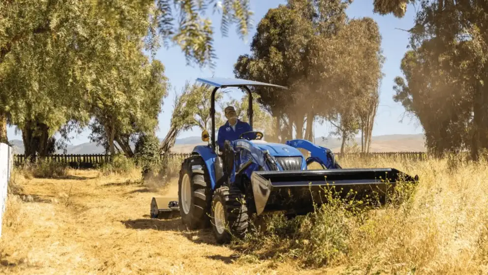New Holland Boomer 50 ROPS tractor working in field