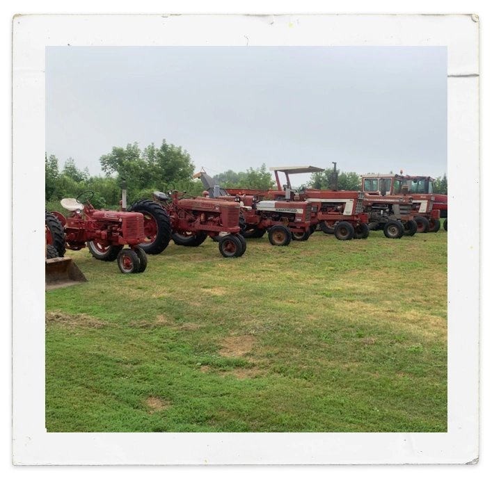 A whole fleet of Case IH farming equipment lining up in the field