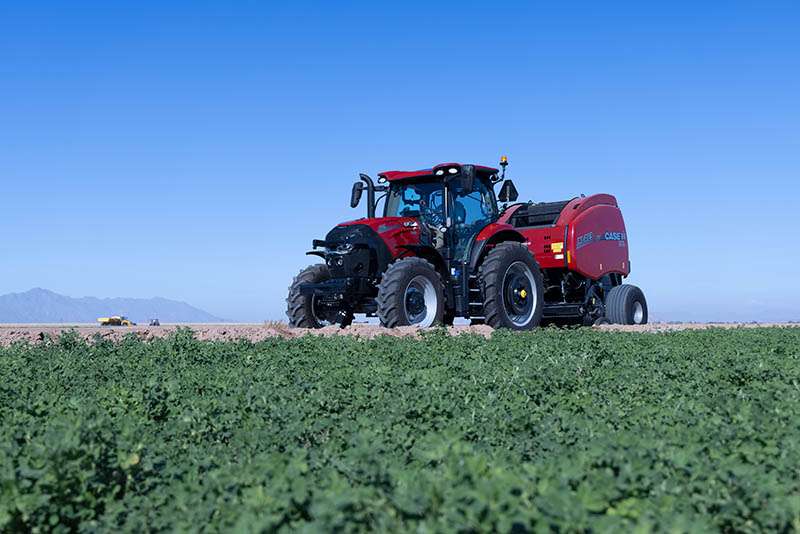 Puma 165 and RB465 baler on edge of field