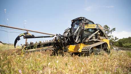 New Holland Construction with trencher attached.