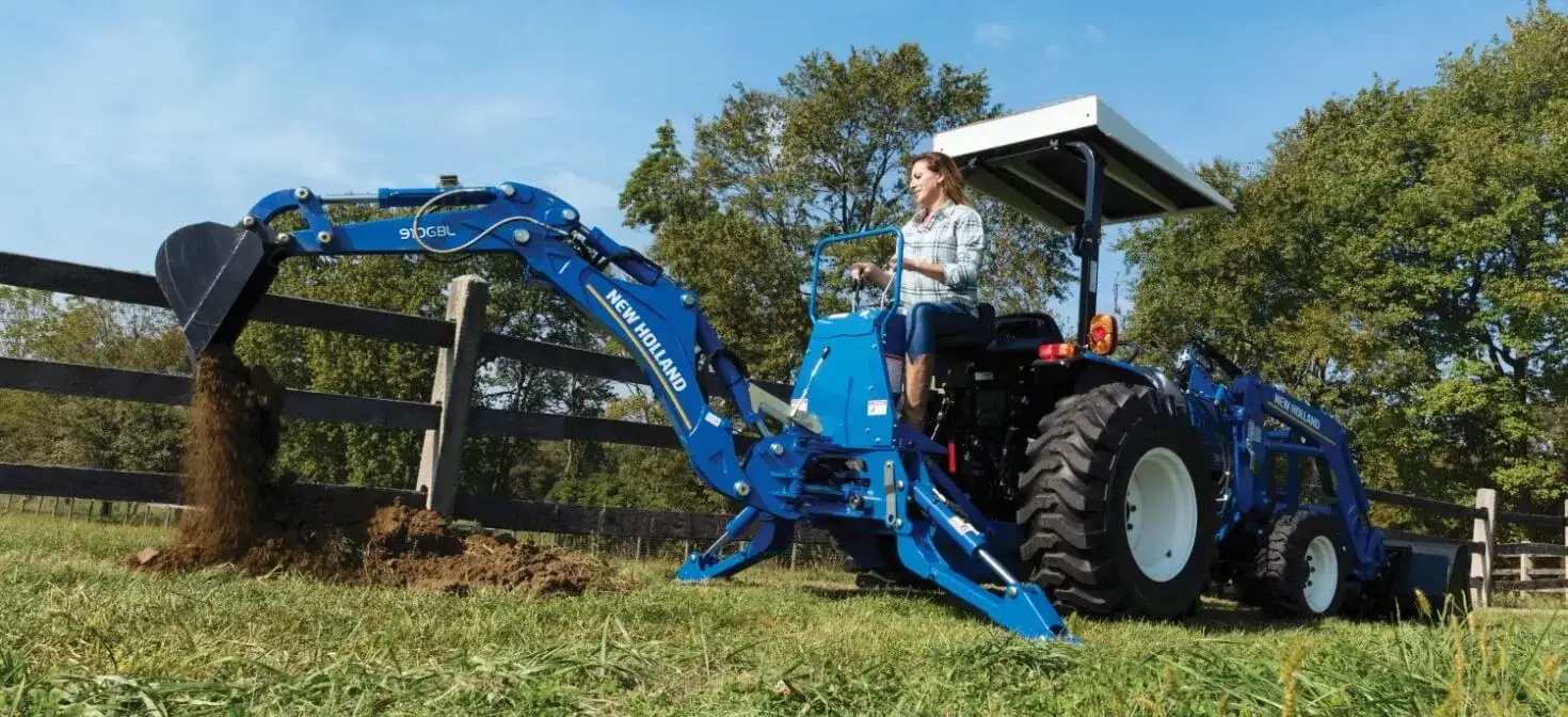 WORKMASTER compact tractor with backhoe attachment