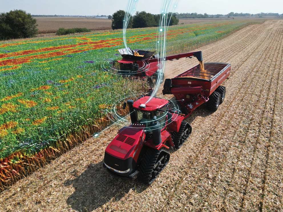 Axial Flow 9250 and Steiger 525 interconnected and harvesting