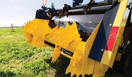 Yellow beaters on the back of a yellow box spreader.