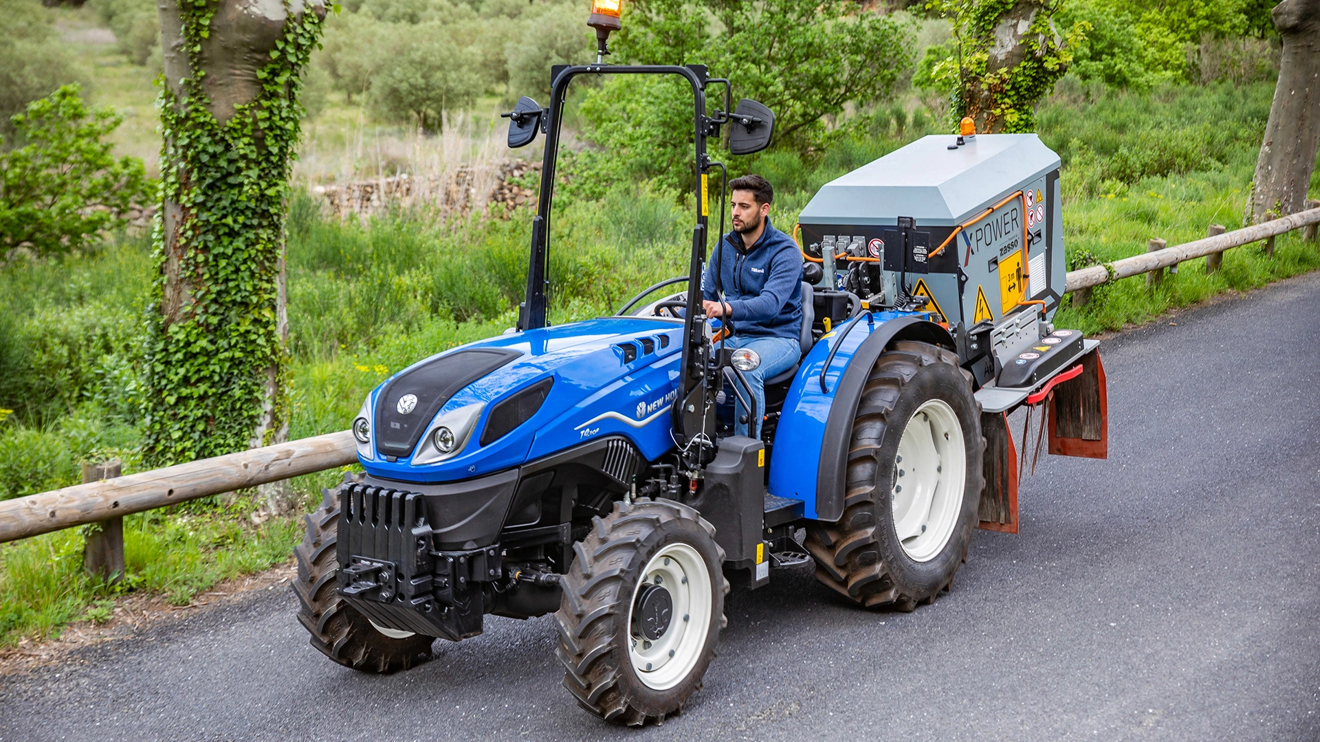 New Holland T4 FNV tractor transporting agricultural supplies