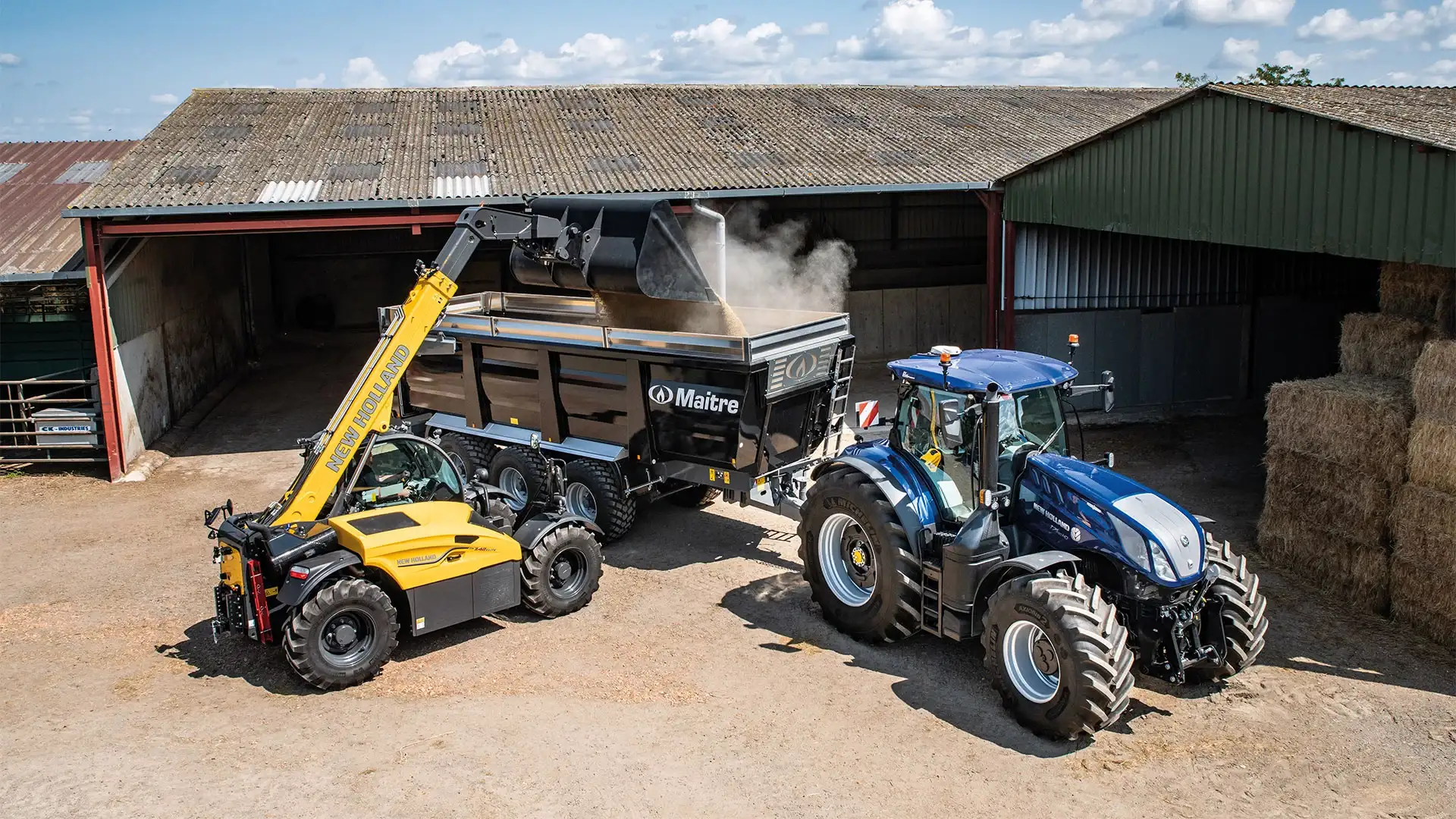 New Holland telehandler and tractor at work near a barn, efficiently handling agricultural materials.