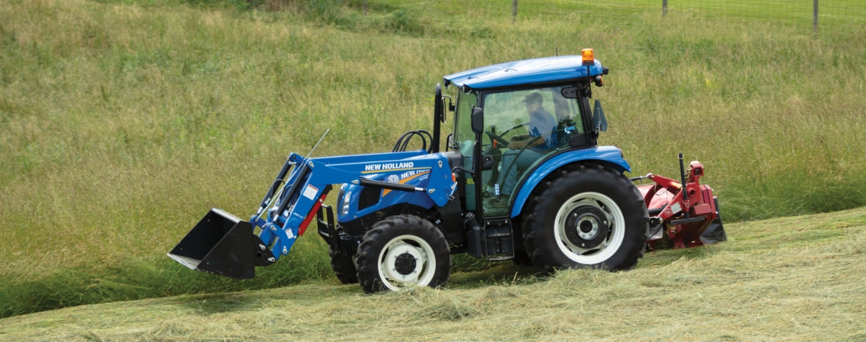 WORKMASTER tractor with disc mower attachment