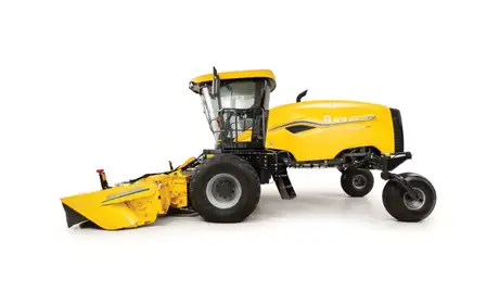 Side profile of yellow windrower.