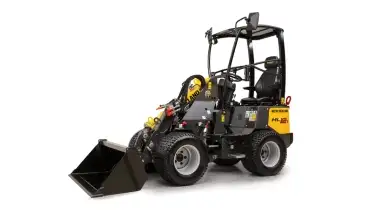 Small articulated loader from the side.