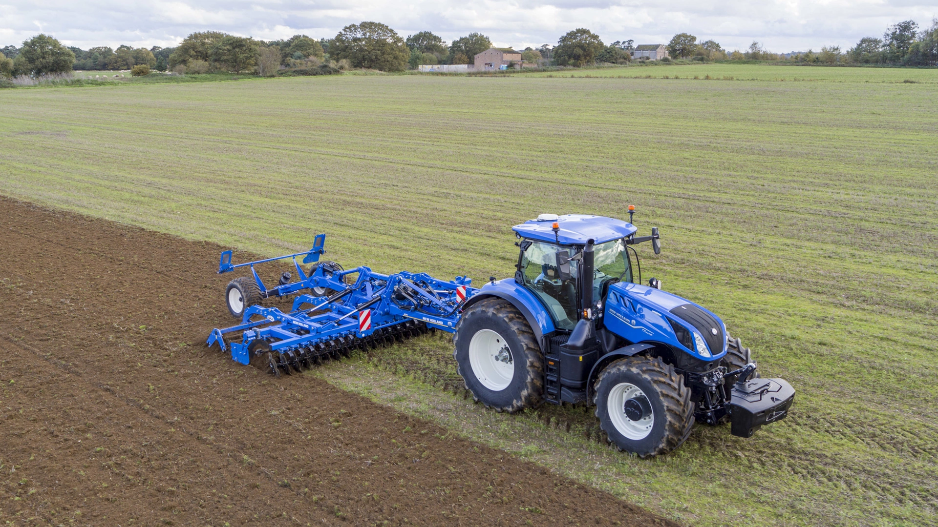 New Holland's Tractor with SDM & SDH Disc Cultivators working on the field