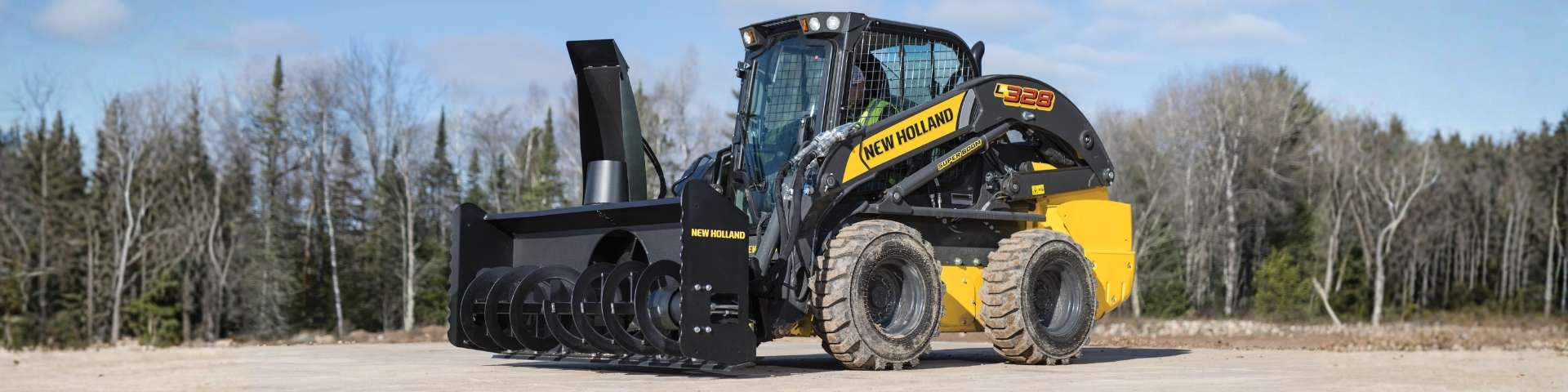 Skid steer loader with snow blower.