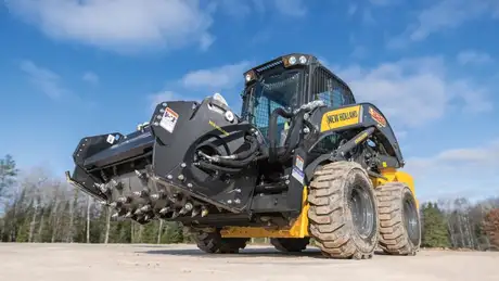 New Holland Construction Skid Steer Loader with Cold Planer attached.