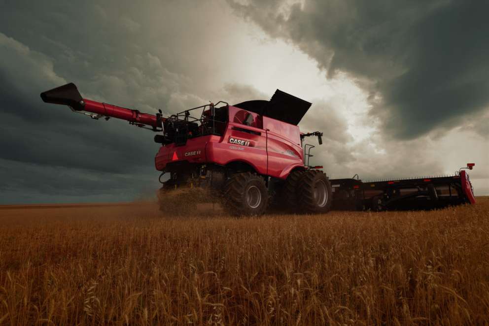 8250 Axial-Flow Combine with stormy sky