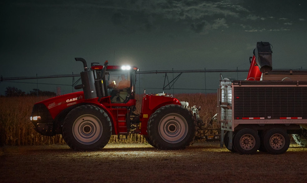 Steiger 420 tractor at night in corn field