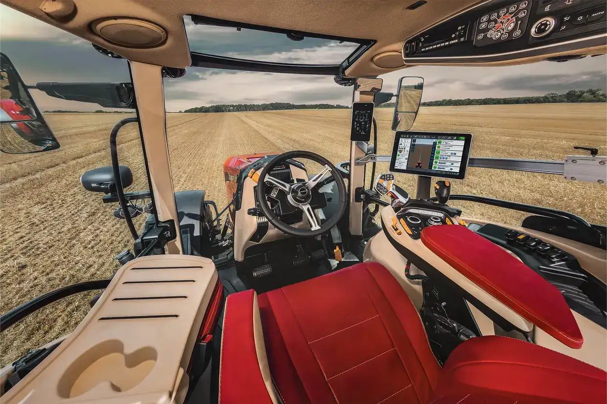 Interior shot of Puma 185 tractor showing seat and display featuring Pro 1200 display