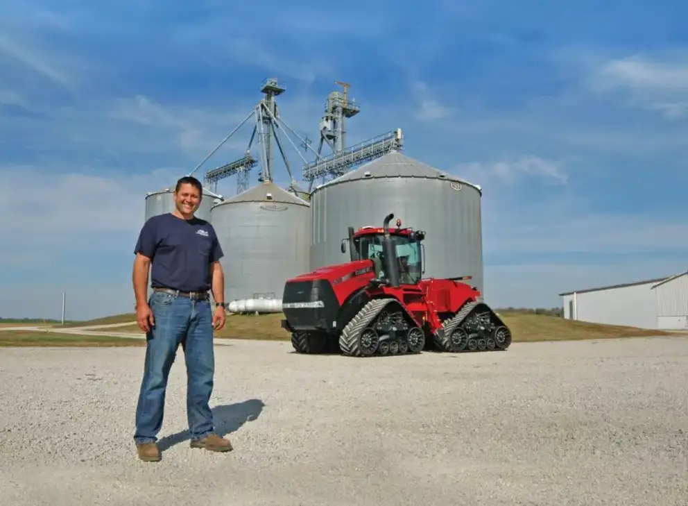 Farmer Jason Strode next to a Case IH tractor