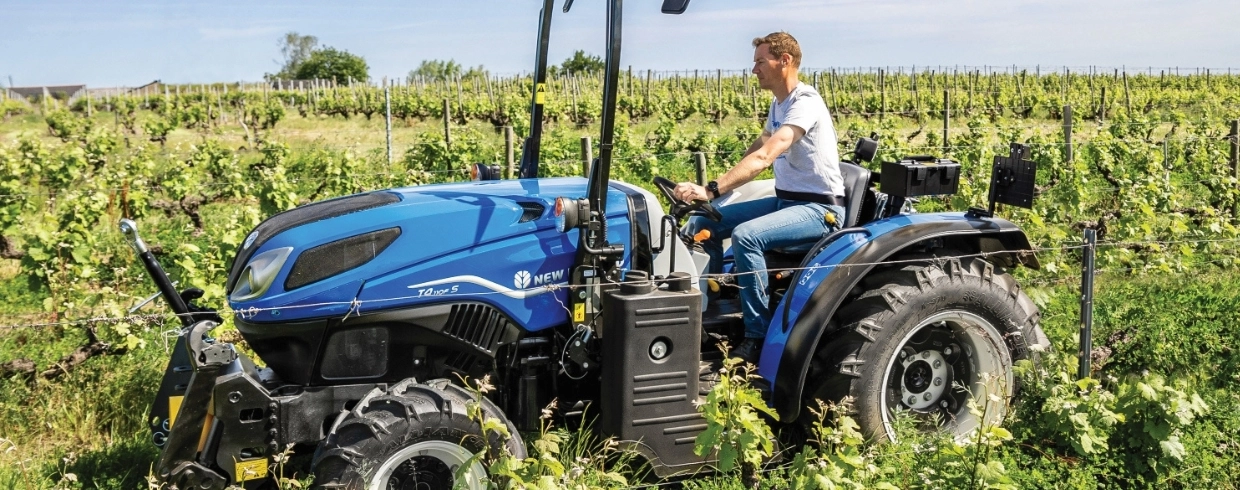 T4F S Specialty Tractor navigates an orchard