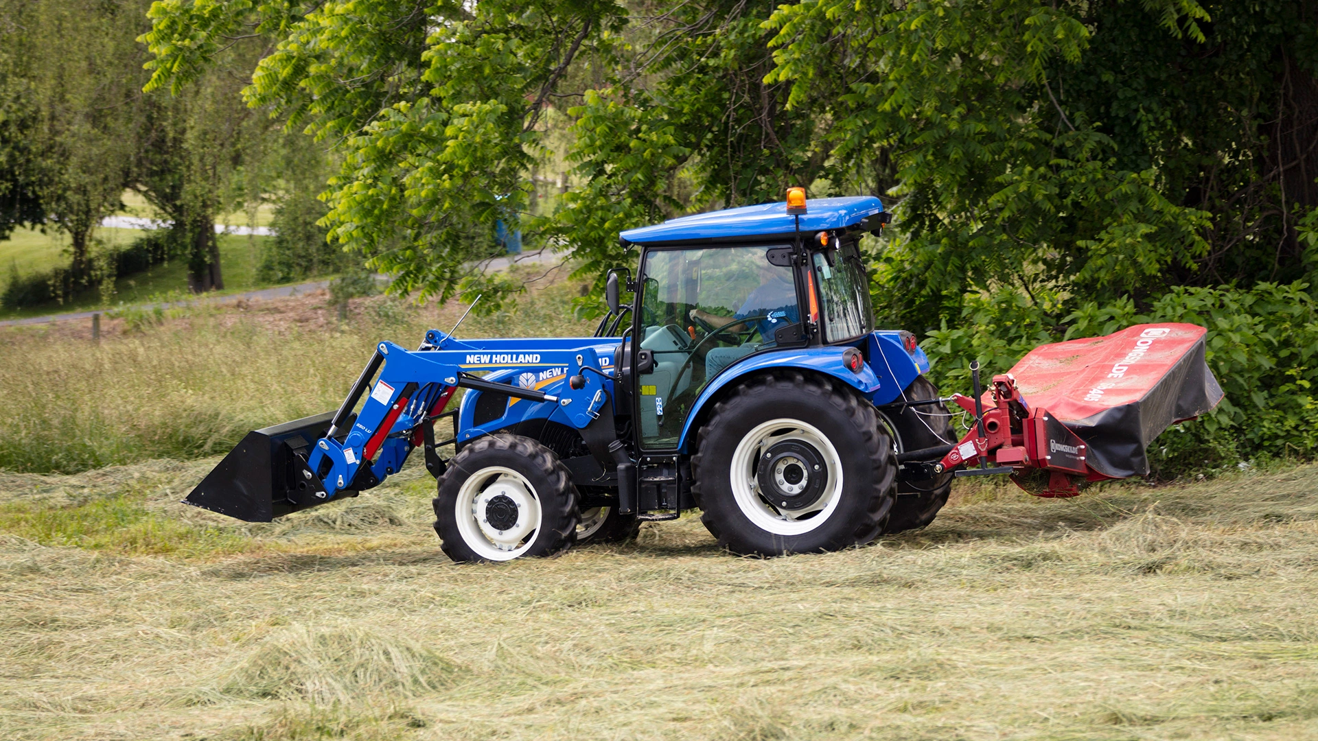 WORKMASTER tractor with disc mower implement