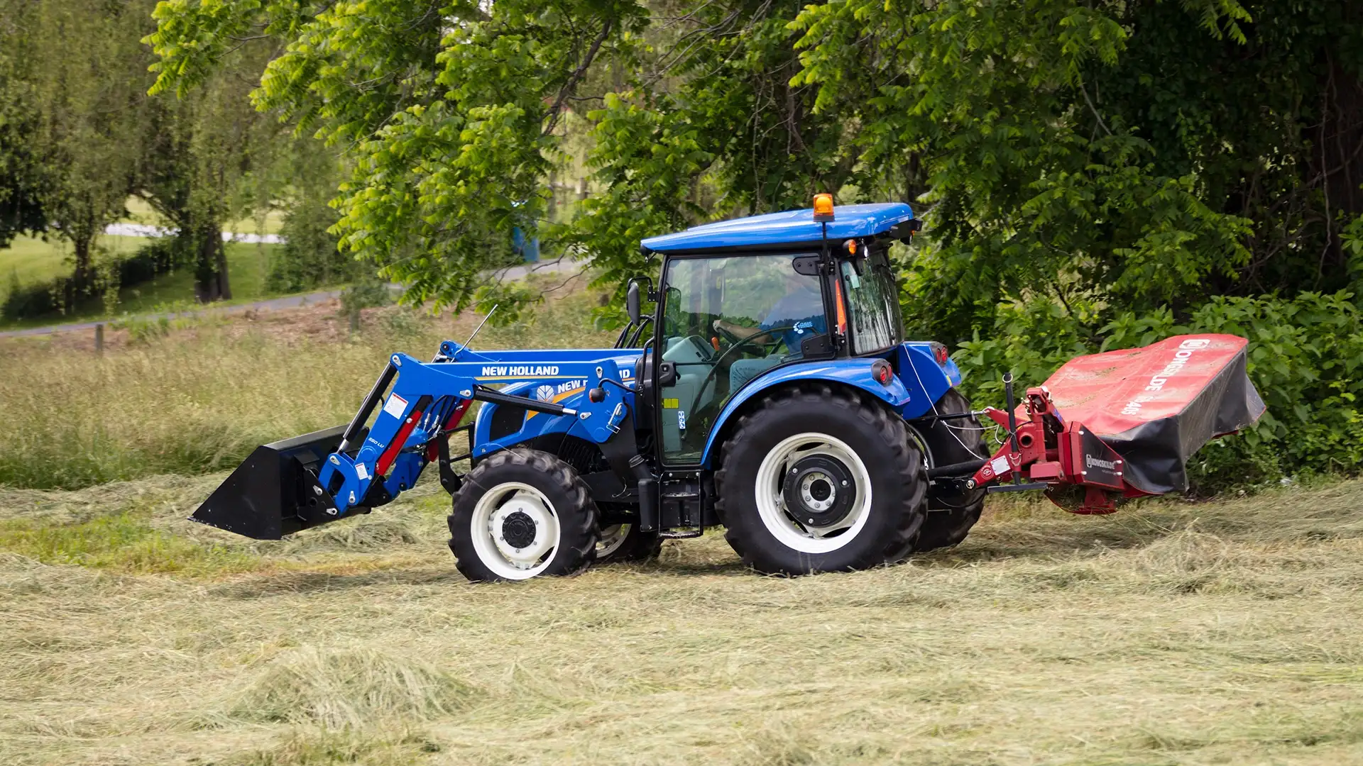 WORKMASTER tractor with disc mower implement