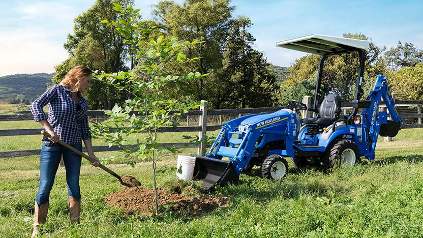 WORKMASTER 25S tractor with a bucket and backhoe attachment