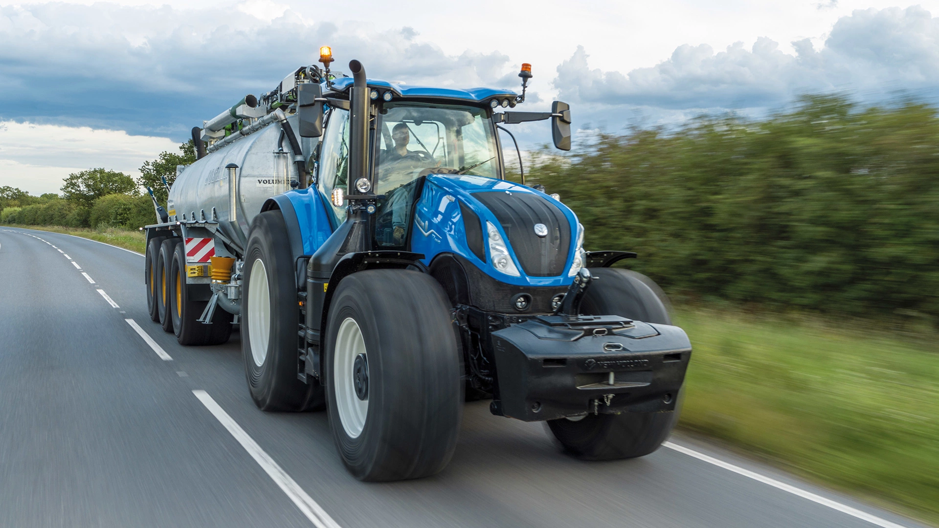 T7 Heavy Duty With PLM Intelligence Tractor transporting