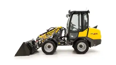 Small articulated loader side view.