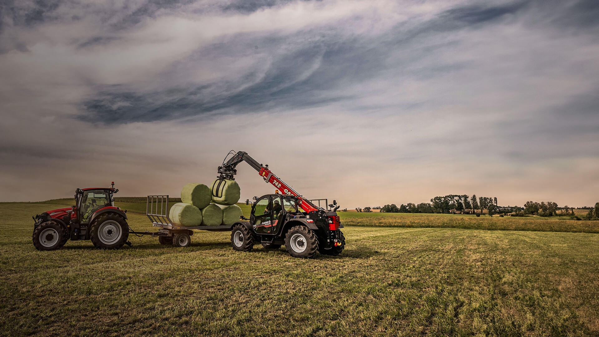 Case IH Farmlift 742 telehandler in field with hay