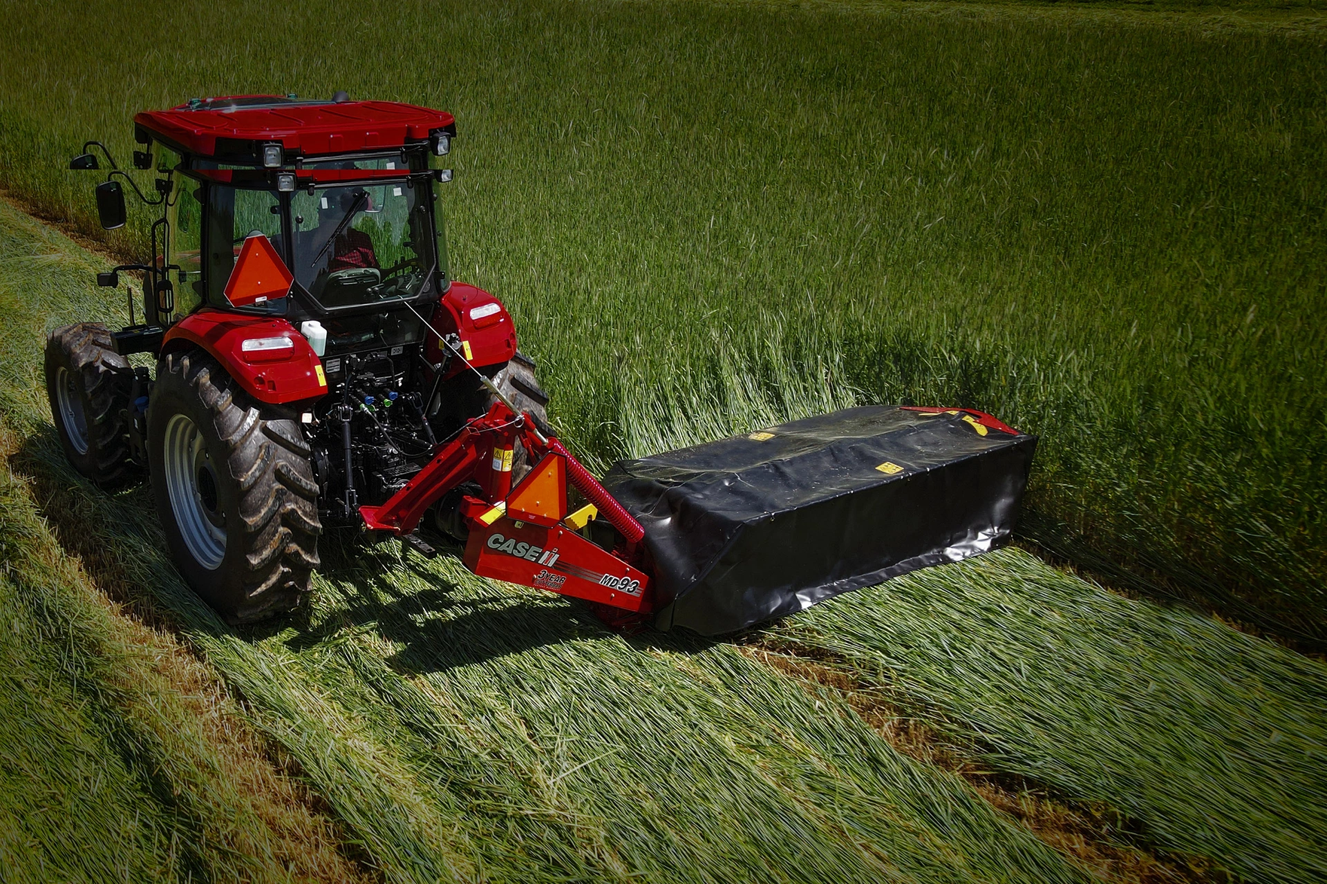 A Case IH tractor with MD93 disc mower