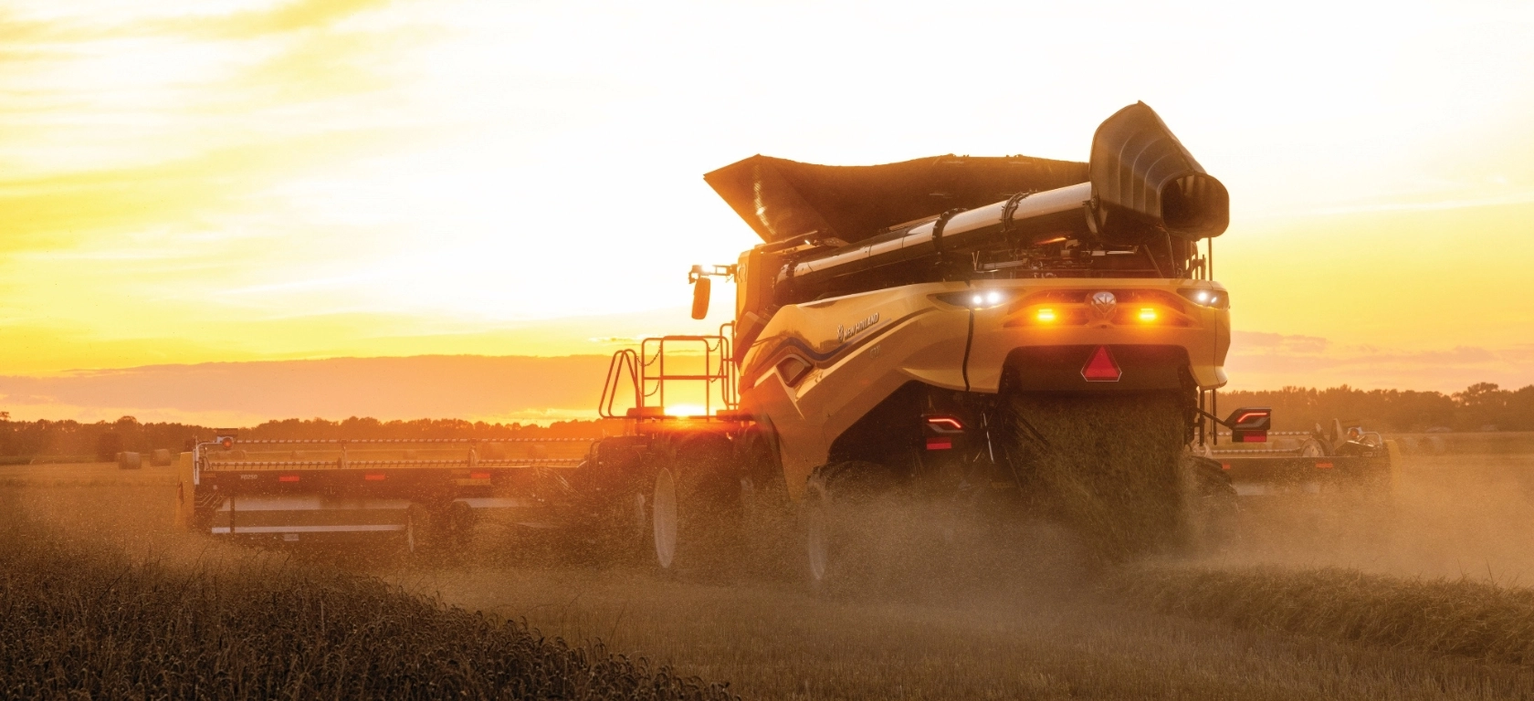 New Holland CR Series combine in the field from behind