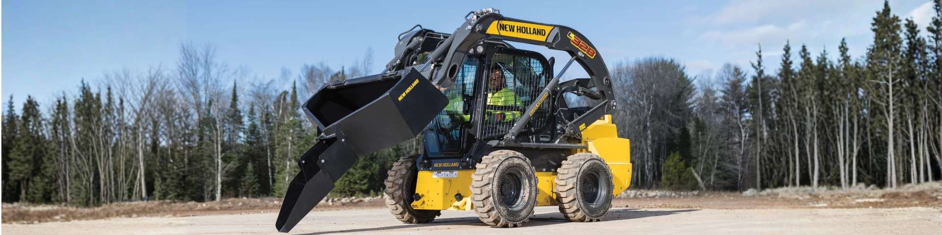 Skid steer loader with concrete bucket.