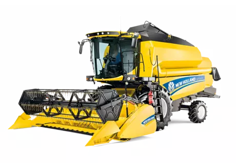 New Holland TC combine harvester with its distinctive yellow coloring, featuring a grain header.
