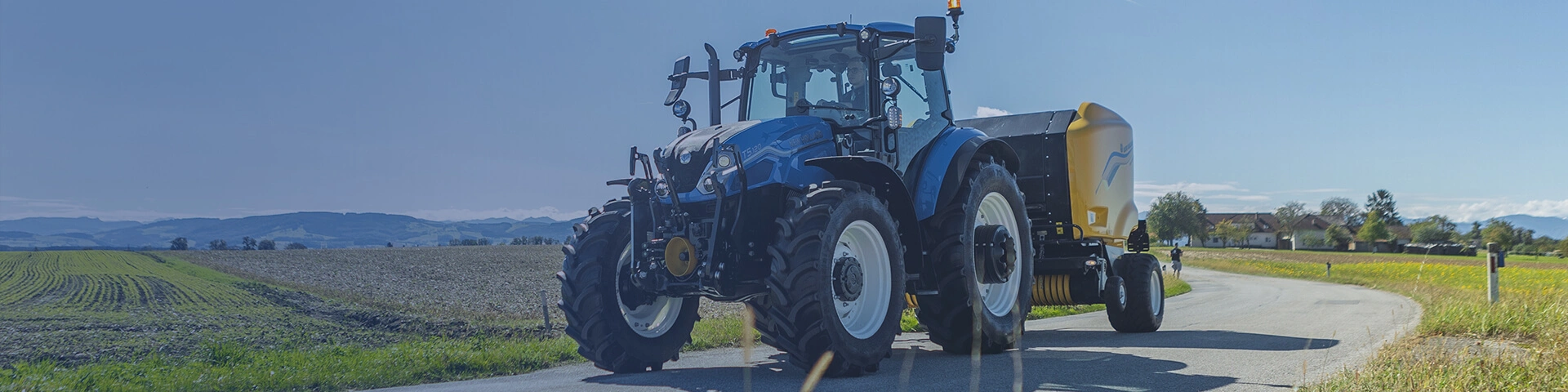 New Holland T5 Dual Command MY25 model working on road