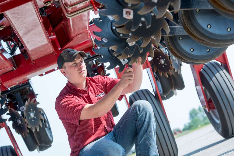 technician servicing planter