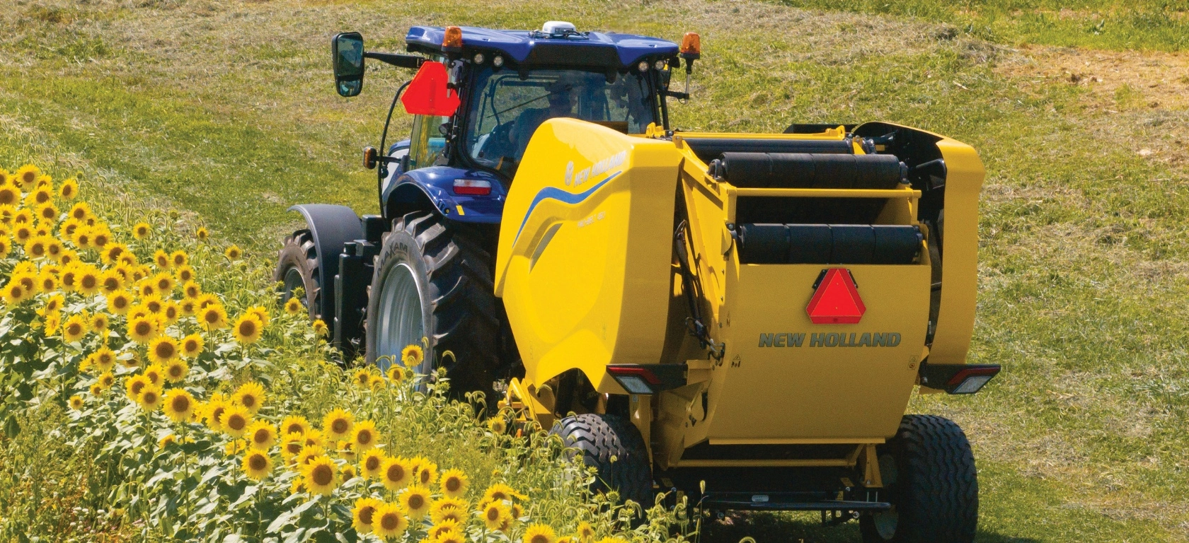 Pro-Belt™ Round Baler pulled by a tractor