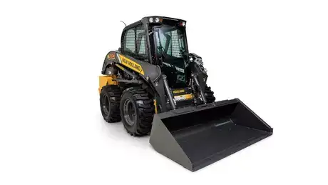 foto de estúdio com a minicarregadeira L320 da New Holland destacando sua frente e lateral. 