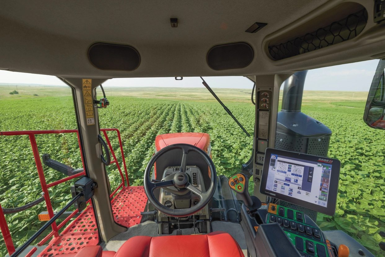 cab view of trident 5550 in sunflower field